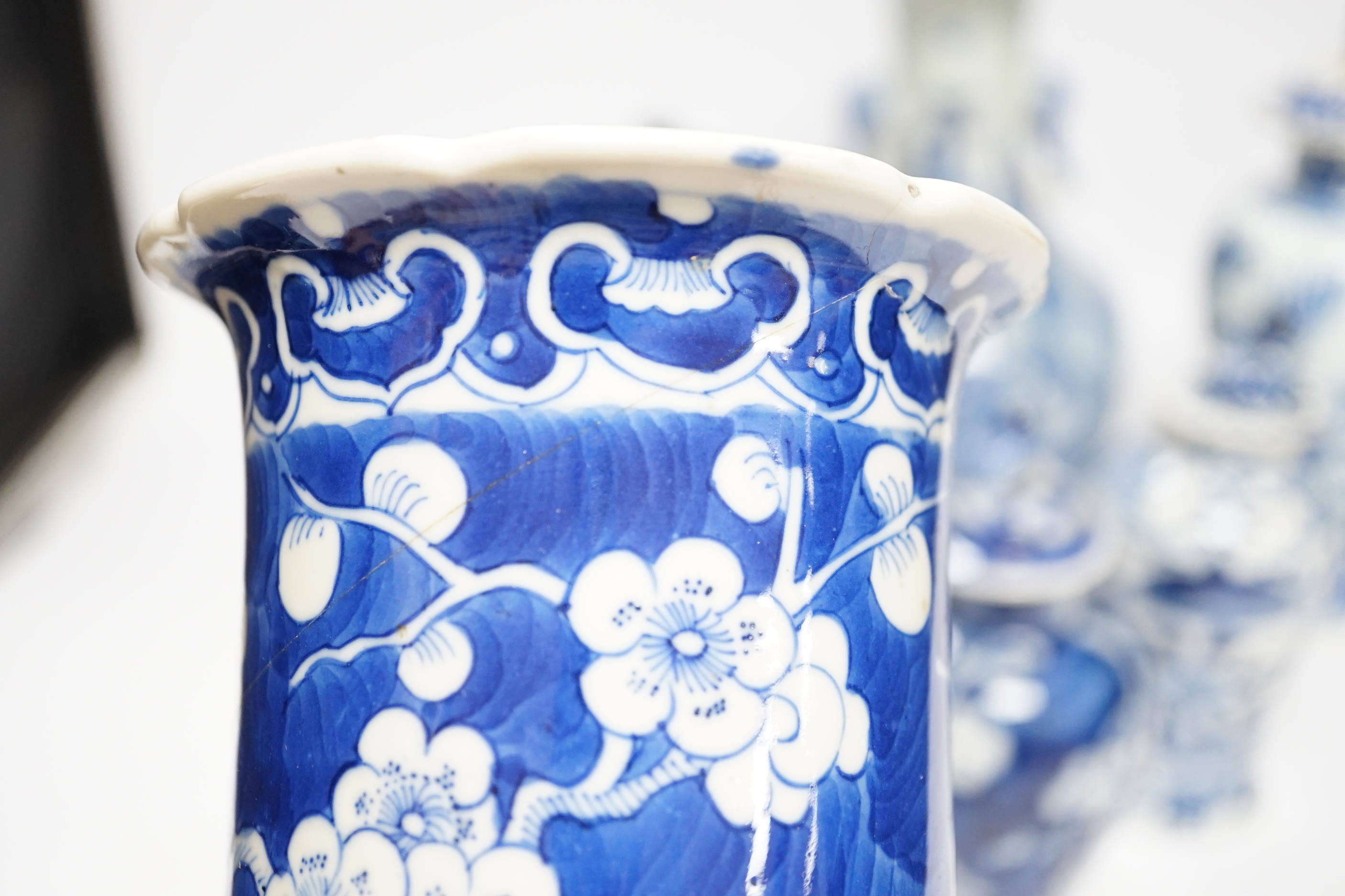 A late 19th century Chinese blue and white twin elephant head handle vase and five other 19th century Chinese blue and white vases, tallest 26cm